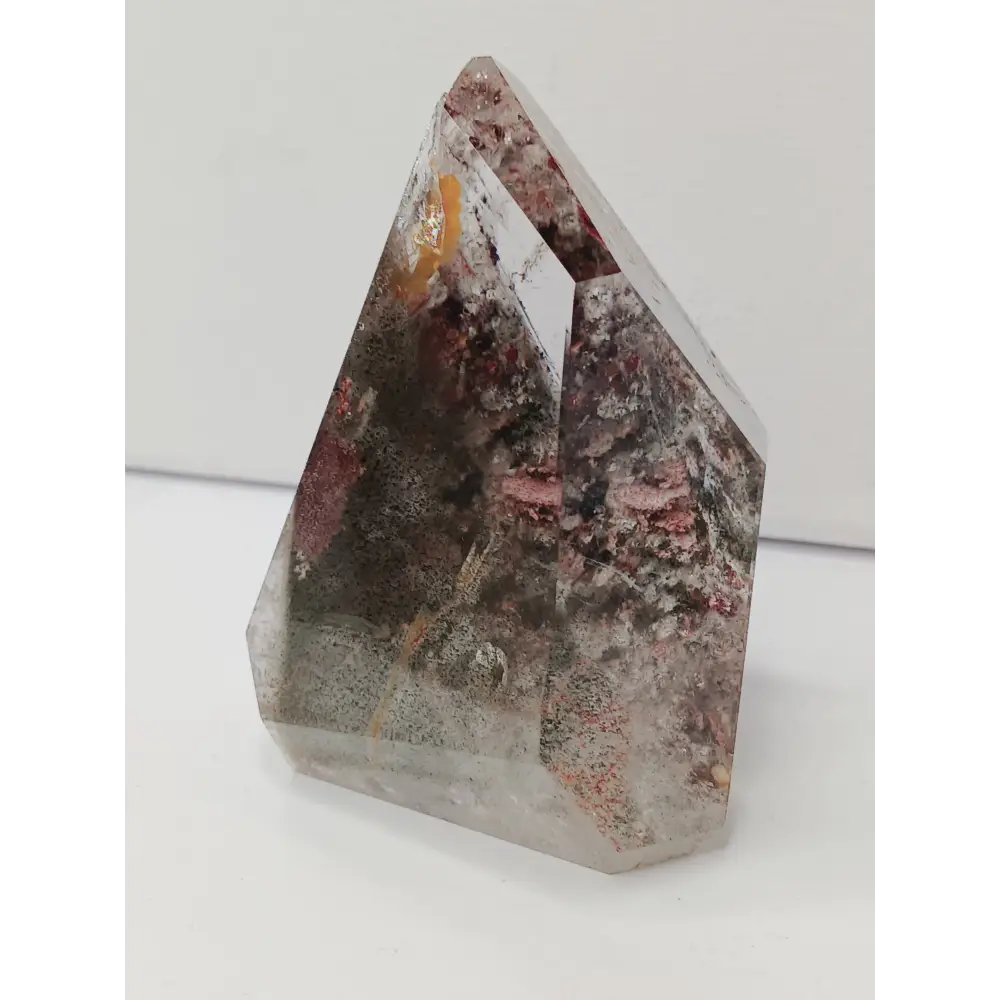 Hexagonal crystal with multicolored patterns on a white background