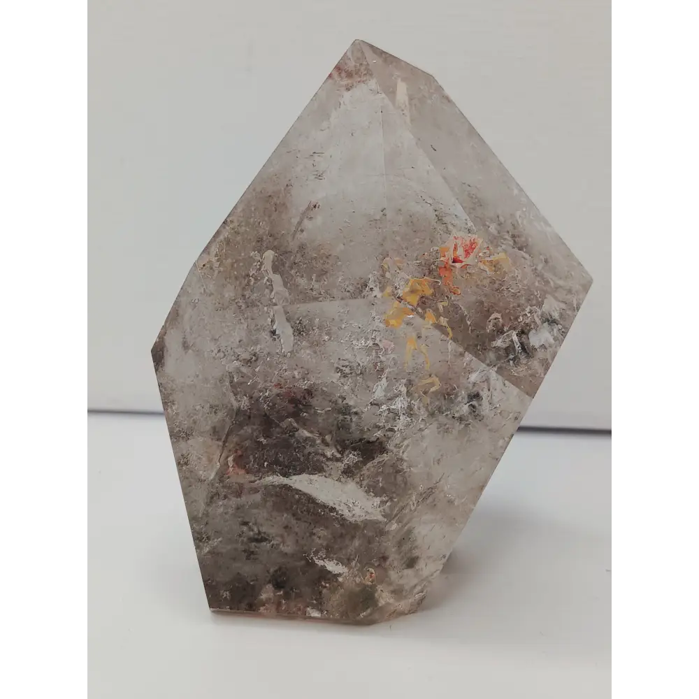 Hexagonal stone with natural patterns on a white background