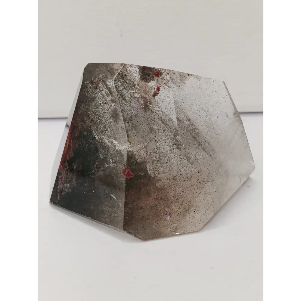Hexagonal stone with a rough texture on a white background