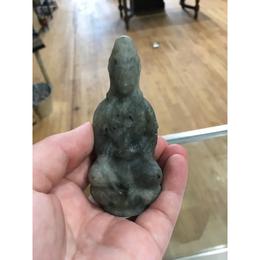 Hand-carved Goddess Guanyin statue made from genuine labradorite, featuring iridescent flashes of blue, green, and gold, displayed upright on a white background.