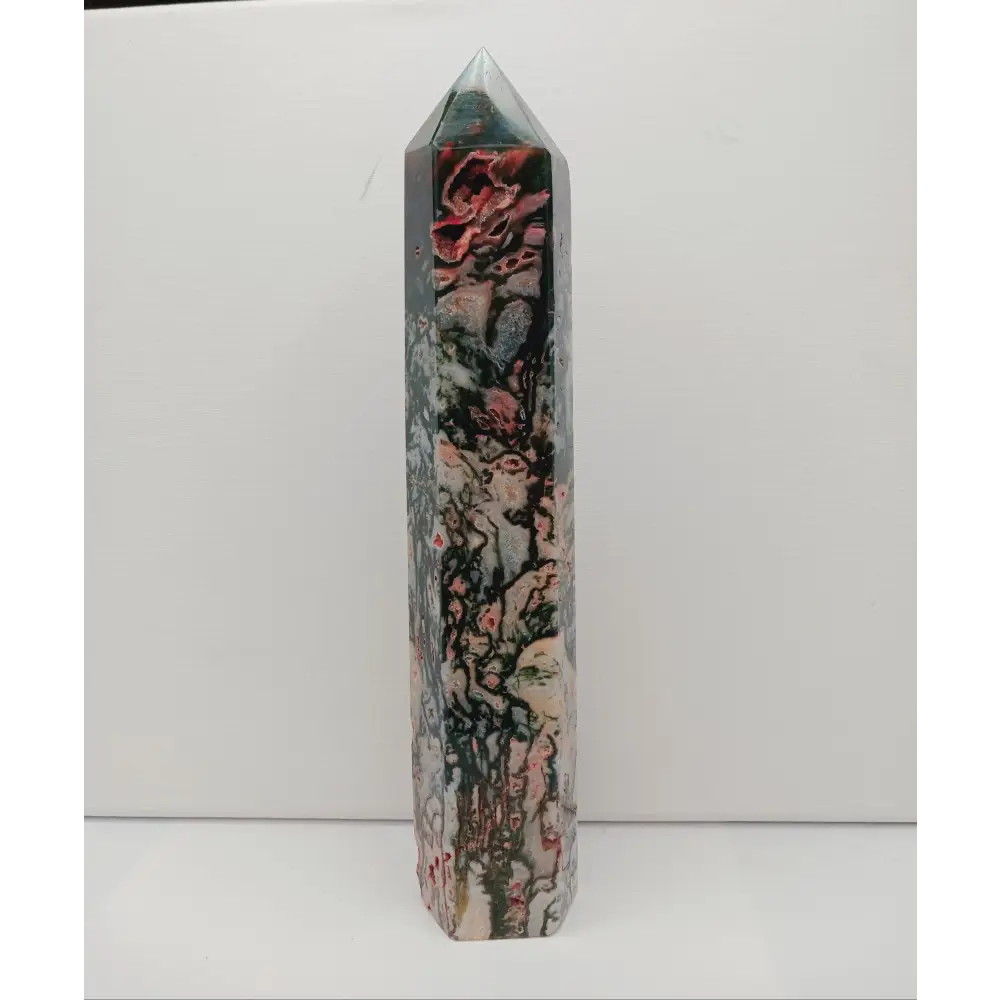 Marbled stone crystal on a white background