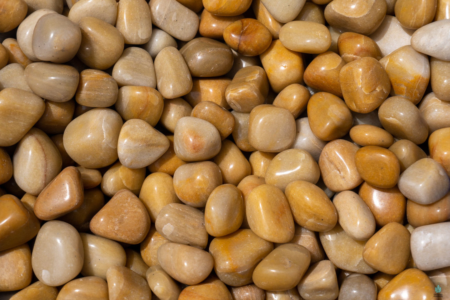 Polished yellow aventurine tumble with warm golden hues, displayed on a white background. Perfect for optimism, empowerment, and solar plexus energy.