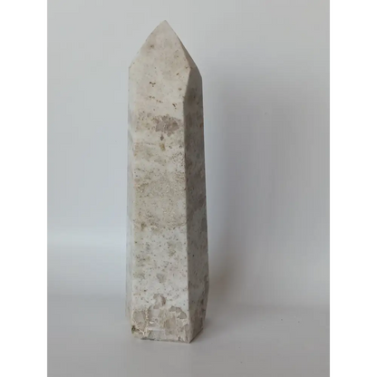 Hand-carved Albite Mica tower featuring radiant white albite with shimmering mica inclusions, displayed on a white background.