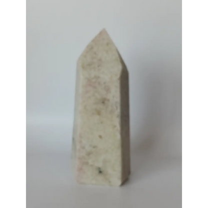 Hand-carved Albite Mica tower featuring radiant white albite with shimmering mica inclusions, displayed on a white background.
