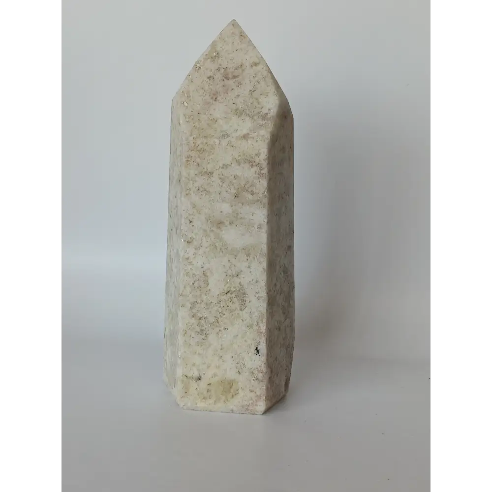 Hand-carved Albite Mica tower featuring radiant white albite with shimmering mica inclusions, displayed on a white background.
