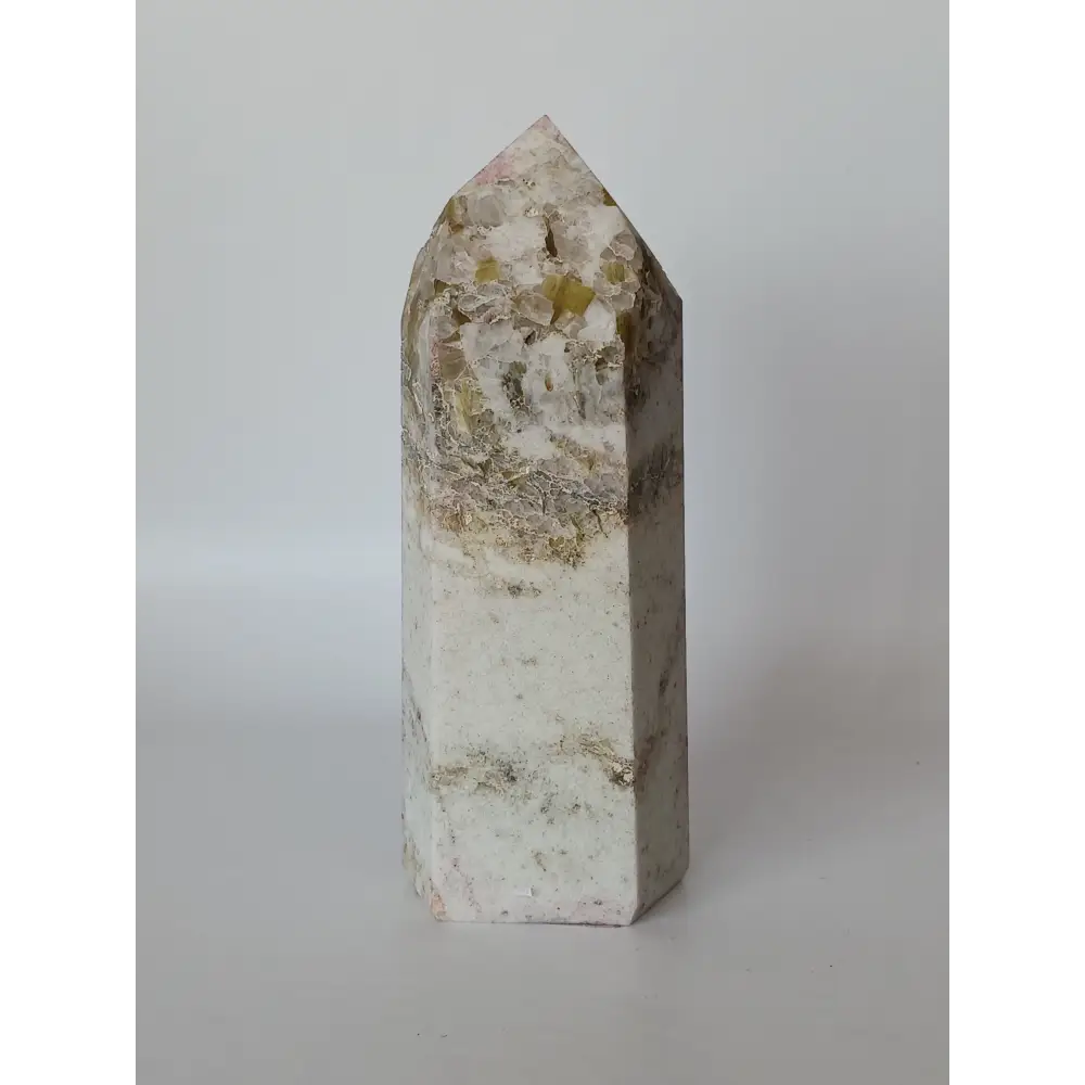 Hand-carved Albite Mica tower featuring radiant white albite with shimmering mica inclusions, displayed on a white background.