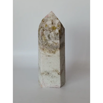 Hand-carved Albite Mica tower featuring radiant white albite with shimmering mica inclusions, displayed on a white background.