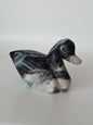 Assorted hand-carved animal figurines made from Blue Tiger’s Eye, Fluorite, and Tiger’s Eye crystals, each featuring unique colors and patterns, displayed on a white background.
