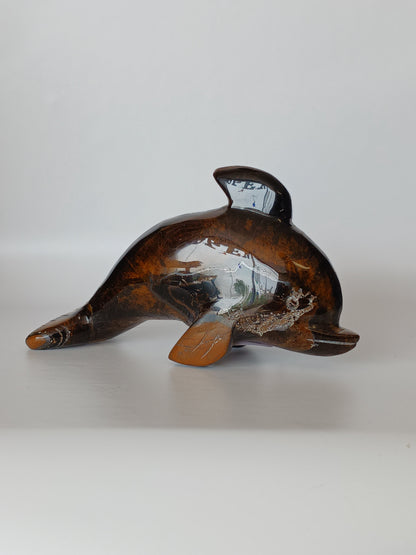 Assorted hand-carved animal figurines made from Blue Tiger’s Eye, Fluorite, and Tiger’s Eye crystals, each featuring unique colors and patterns, displayed on a white background.