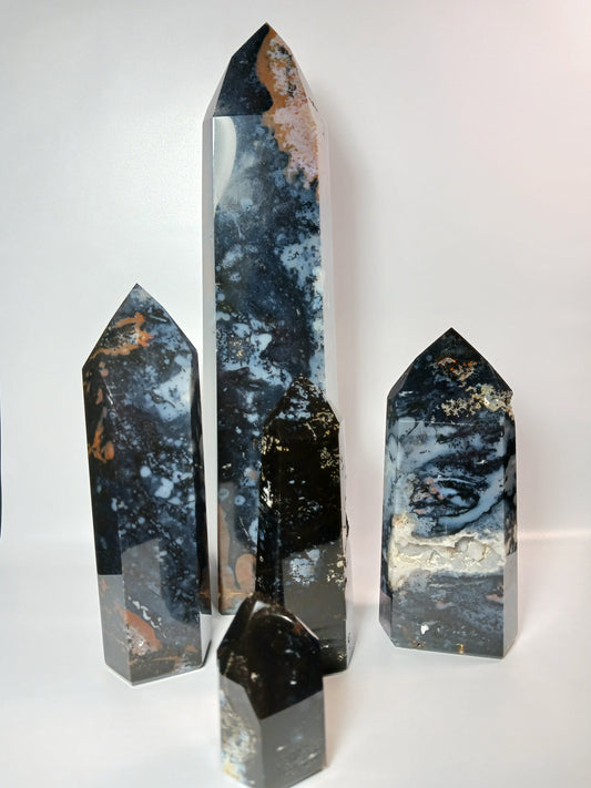 Hand-carved Blue Agate tower with soothing blue bands and natural patterns, displayed on a white background.