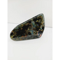 Labradorite freeform with vibrant flashes of blue, green, and gold, polished and displayed on a white background.