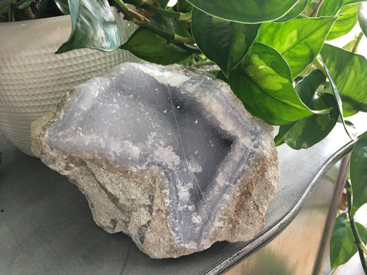 Polished Blue Lace Agate specimen with soft blue and white banding, displayed on a white background. Perfect for calming communication and gentle peace.