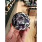 Hand-polished Dream Amethyst sphere featuring vivid purple and white chevron bands, displayed on a white background.