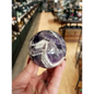 Hand-polished Dream Amethyst sphere featuring vivid purple and white chevron bands, displayed on a white background.