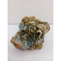 Muscovite with aquamarine specimen, showcasing shimmering layers and blue crystal accents, displayed on a white background.