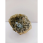 Muscovite with aquamarine specimen, showcasing shimmering layers and blue crystal accents, displayed on a white background.