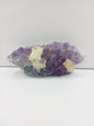 Fine glittery amethyst specimen, featuring sparkling purple points and a shimmering surface, displayed on a white background.