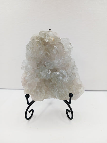 Fine glittery amethyst specimen, featuring sparkling purple points and a shimmering surface, displayed on a white background.