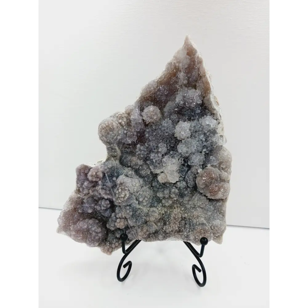 Fine glittery amethyst specimen, featuring sparkling purple points and a shimmering surface, displayed on a white background.