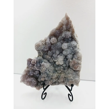 Fine glittery amethyst specimen, featuring sparkling purple points and a shimmering surface, displayed on a white background.