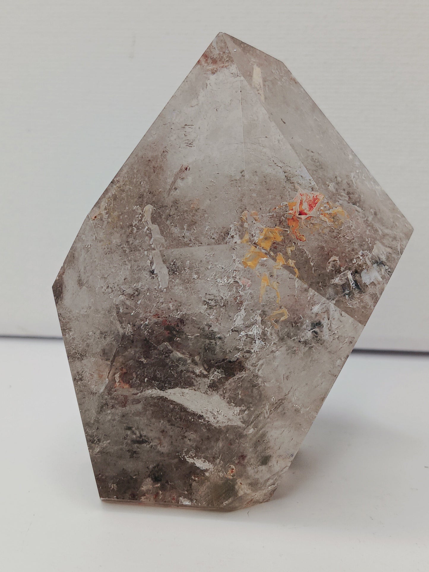 Hexagonal stone with natural patterns on a white background