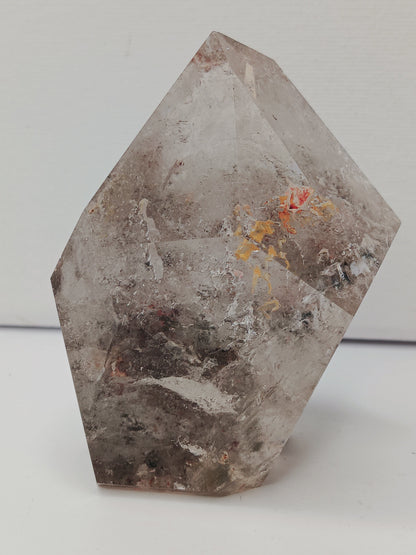 Hexagonal stone with natural patterns on a white background