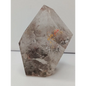Hexagonal stone with natural patterns on a white background