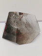 Hexagonal stone with a rough texture on a white background