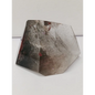 Hexagonal stone with a rough texture on a white background