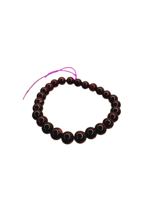 Black beaded bracelet on a white background