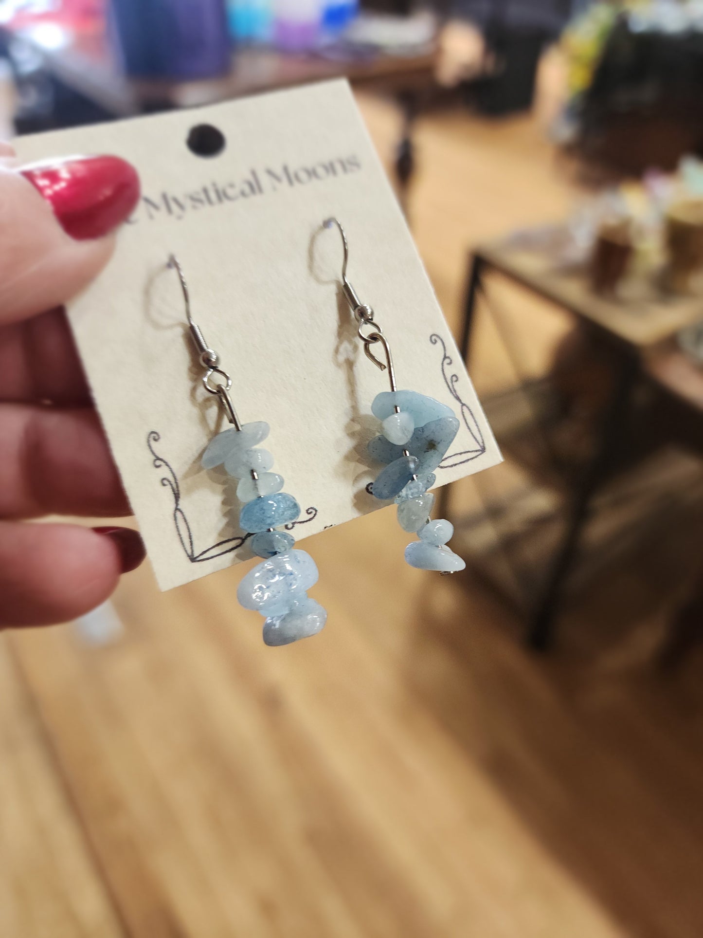 Assorted genuine stone chip earrings in a variety of colors and crystal types, displayed on a white background. Perfect for unique style and everyday crystal energy.