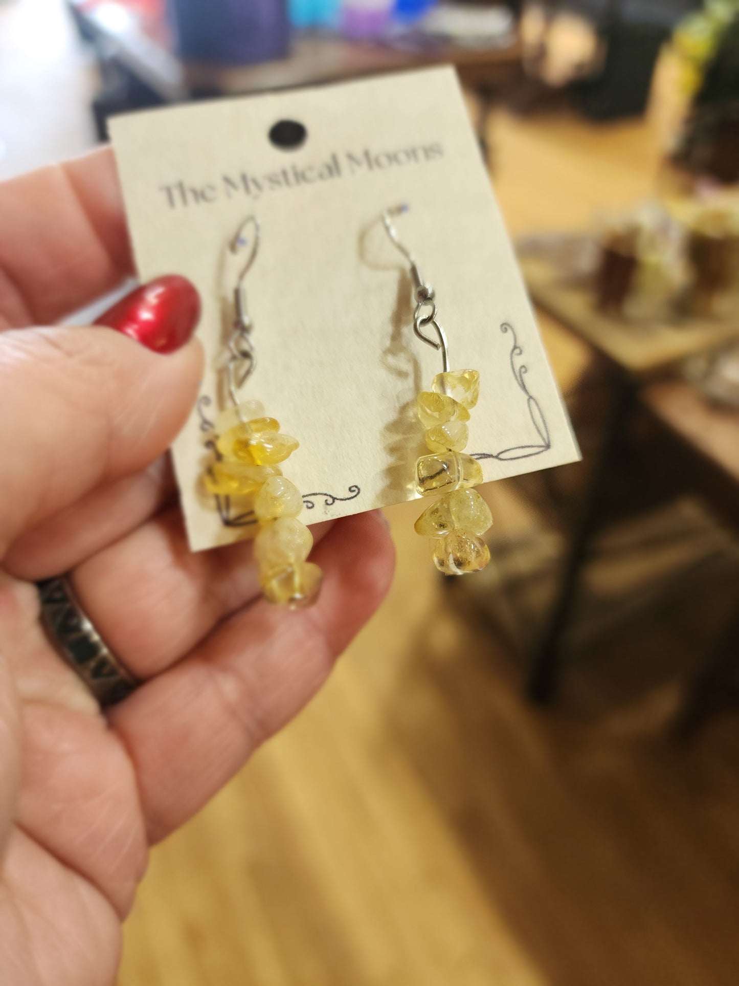 Assorted genuine stone chip earrings in a variety of colors and crystal types, displayed on a white background. Perfect for unique style and everyday crystal energy.