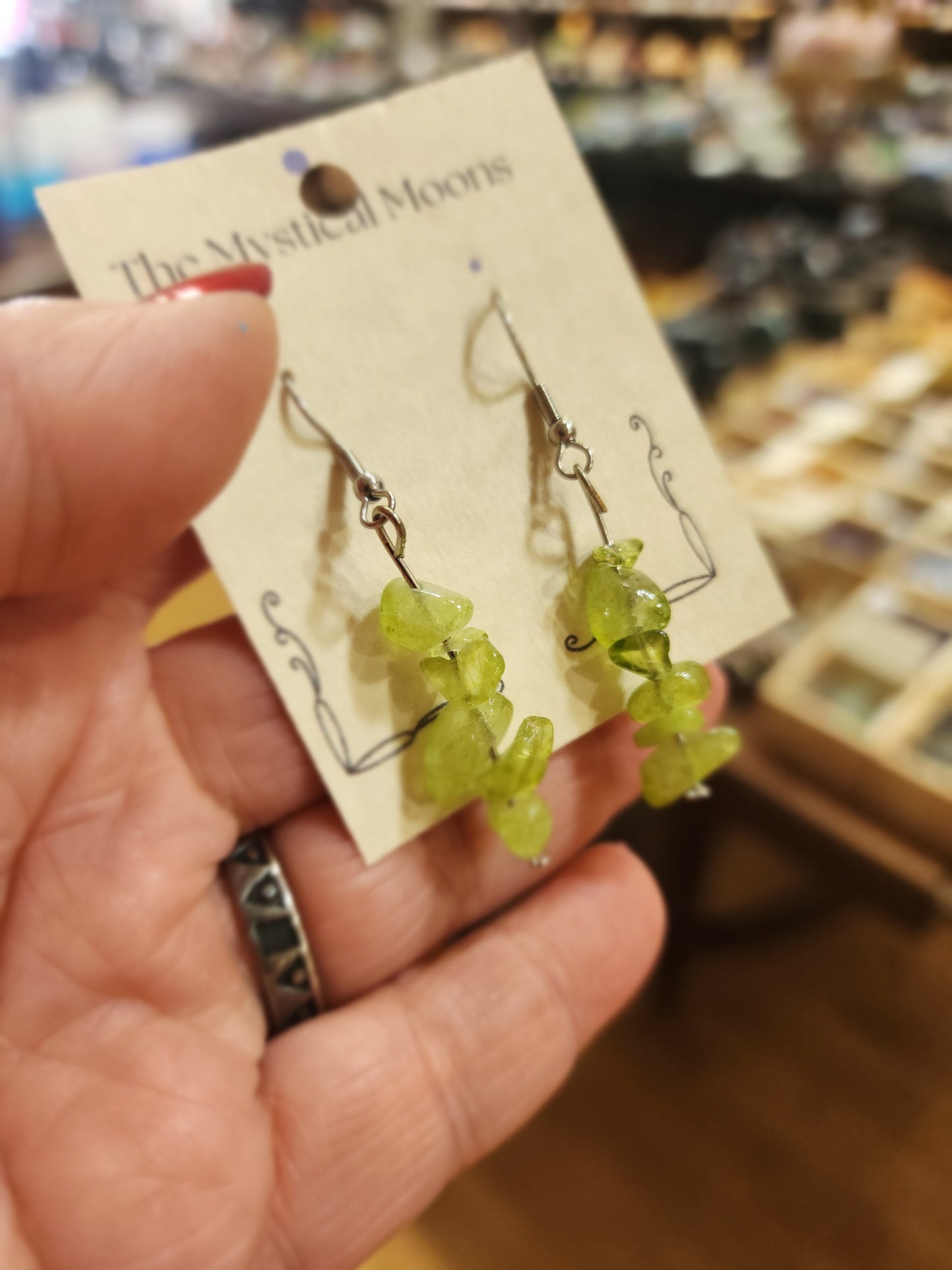 Assorted genuine stone chip earrings in a variety of colors and crystal types, displayed on a white background. Perfect for unique style and everyday crystal energy.