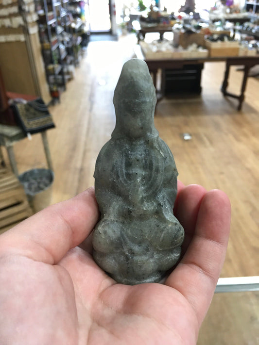 Hand-carved Goddess Guanyin statue made from genuine labradorite, featuring iridescent flashes of blue, green, and gold, displayed upright on a white background.