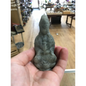 Hand-carved Goddess Guanyin statue made from genuine labradorite, featuring iridescent flashes of blue, green, and gold, displayed upright on a white background.