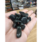 Polished green goldstone tumble with a sparkling, glittery surface, displayed on a white background. Perfect for ambition, abundance, and heart chakra energy.