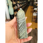 Hand-carved Green Zebra Jasper tower featuring bold green and white banded patterns, displayed on a white background.