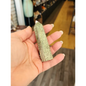 Hand-carved Green Zebra Jasper tower featuring bold green and white banded patterns, displayed on a white background.