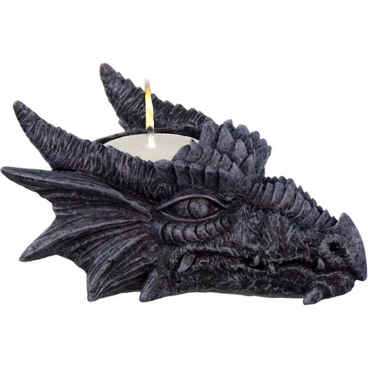 Grey dragon head t-light holder with a fierce, steely gaze, displayed with a tealight candle on a white background.