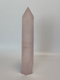 Hand-polished 5.5-inch Rose Quartz tower featuring vibrant, translucent pink hues, displayed on a white background.