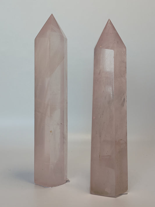 Hand-polished 5.5-inch Rose Quartz tower featuring vibrant, translucent pink hues, displayed on a white background.
