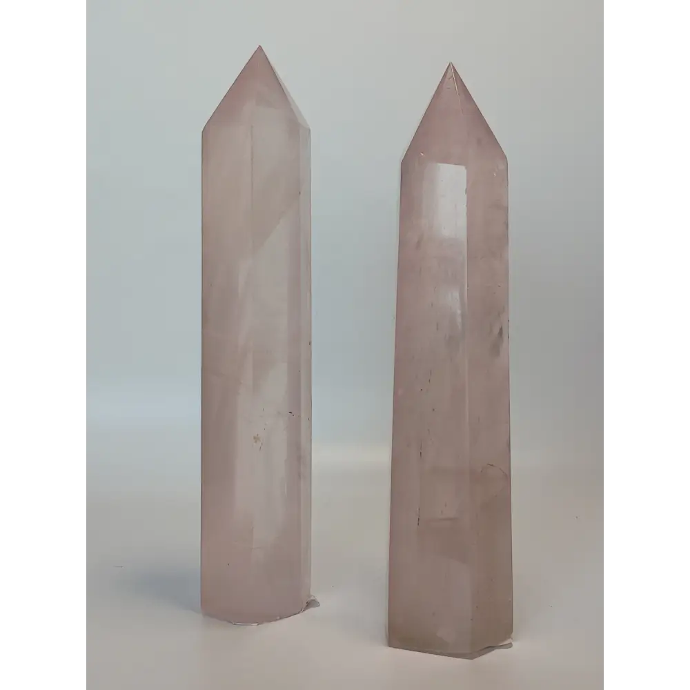 Hand-polished 5.5-inch Rose Quartz tower featuring vibrant, translucent pink hues, displayed on a white background.