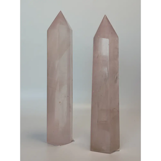Hand-polished 5.5-inch Rose Quartz tower featuring vibrant, translucent pink hues, displayed on a white background.