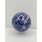 Decorative knob with blue and gold speckled pattern on a white background