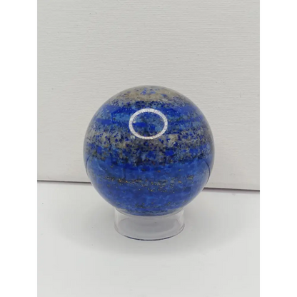 Blue glass door knob on a white door