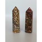 Hand-carved Leopard Jasper point featuring bold, earthy spotted patterns and a polished finish, displayed on a white background.