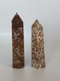 Hand-carved Leopard Jasper point featuring bold, earthy spotted patterns and a polished finish, displayed on a white background.
