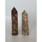 Hand-carved Leopard Jasper point featuring bold, earthy spotted patterns and a polished finish, displayed on a white background.