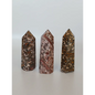Hand-carved Leopard Jasper point featuring bold, earthy spotted patterns and a polished finish, displayed on a white background.
