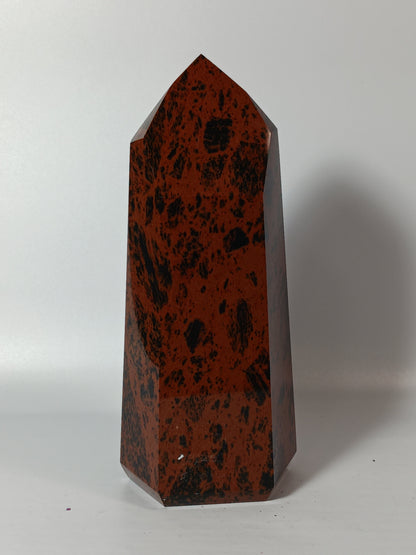 Hand-carved Mahogany Obsidian tower with rich brown and black swirls, displayed on a white background.